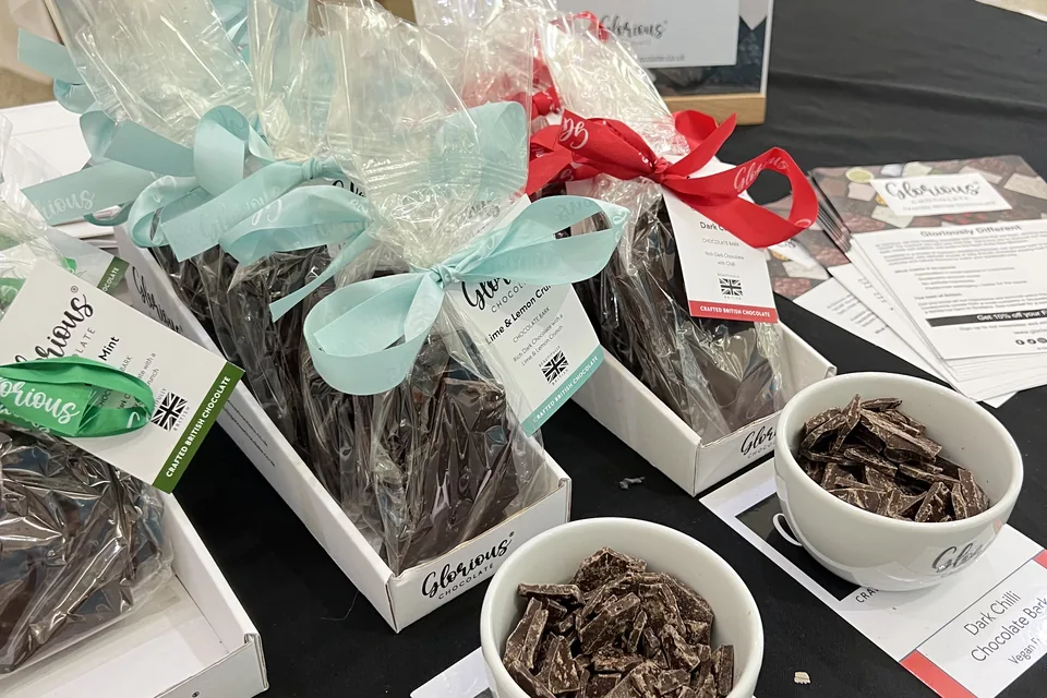 Glorious Chocolate bark in ribboned cellophane bags with bowls of tasting pieces